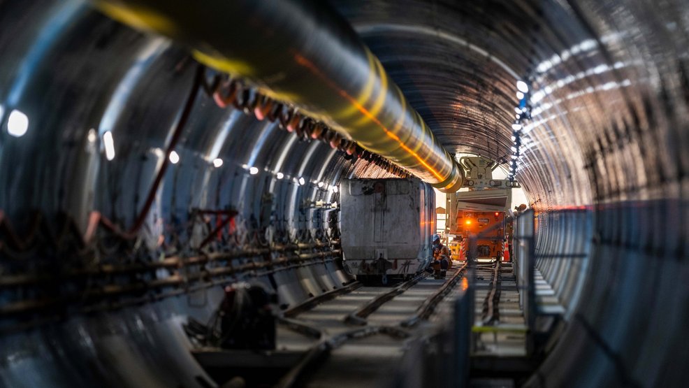 Construction of main tunnel is lined with yellow, blue, pink and grey Ultra Grip concrete protective liner. [Source: Watercare]